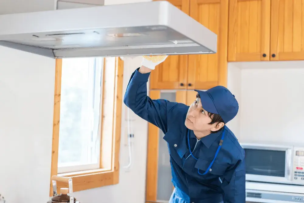One Click Dubai technician fitting a bathroom exhaust fan