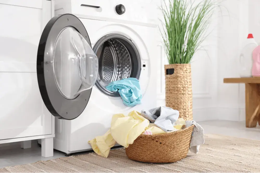 One Click Dubai technician repairing a Sharp washing machine