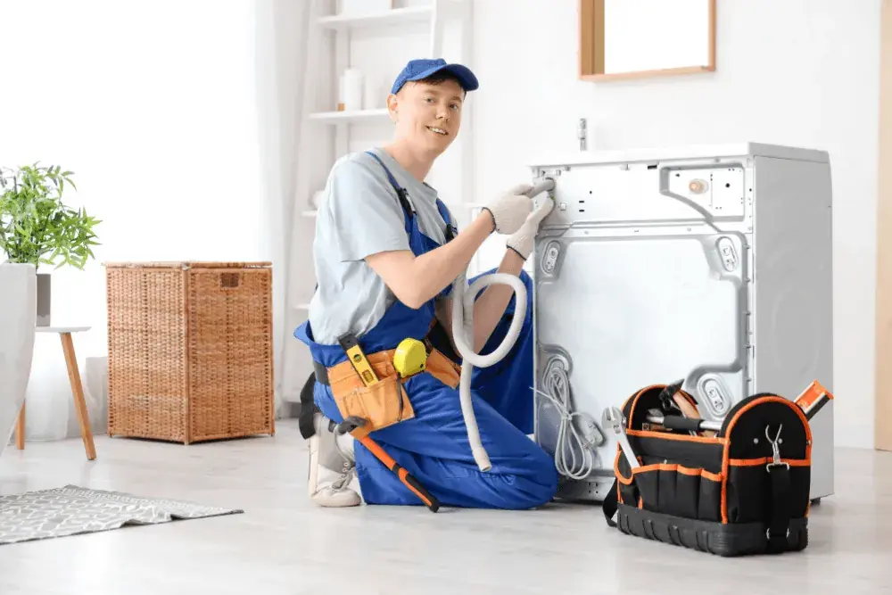 One Click Dubai technician repairing a Daewoo washing machine