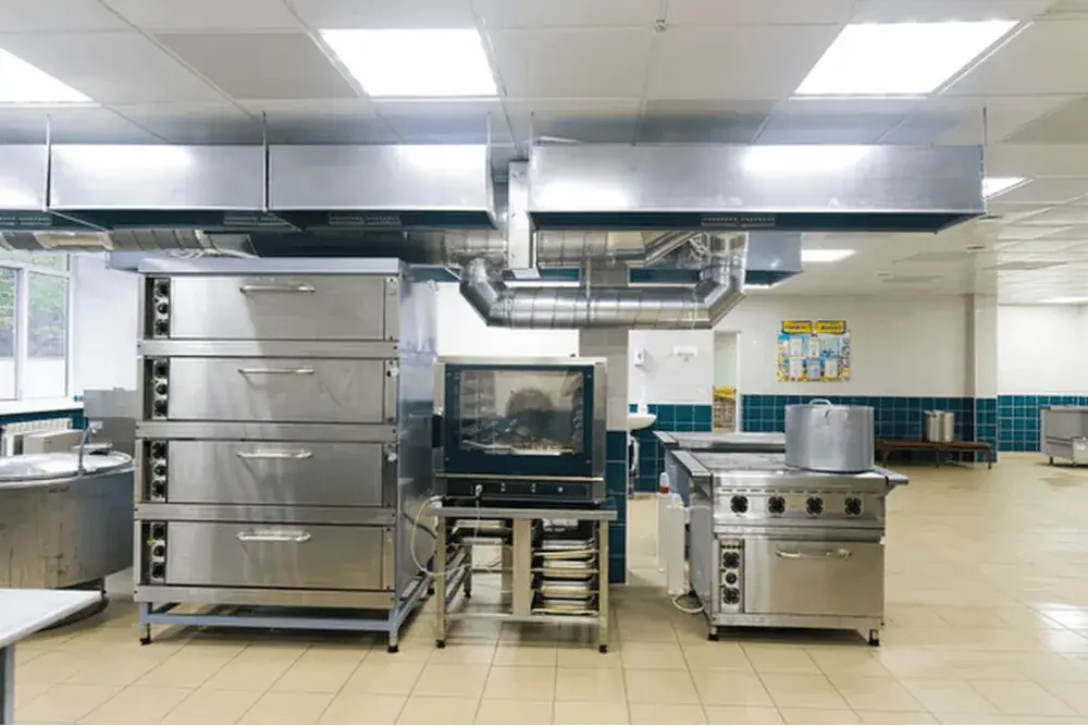 Commercial kitchen with ovens and extraction